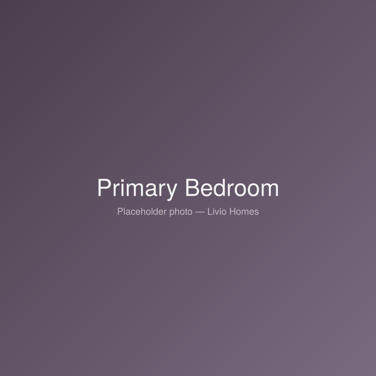 Primary bedroom with soft linens and natural light